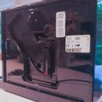 Le bloc d'extraction est accessible sur le côté de la machine. (c) Labo Maison