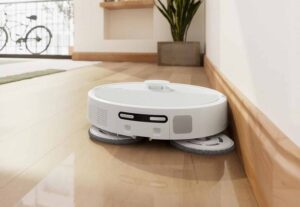 Serpillière latérale du Roomba 505 Plus atteignant les bords des murs.
