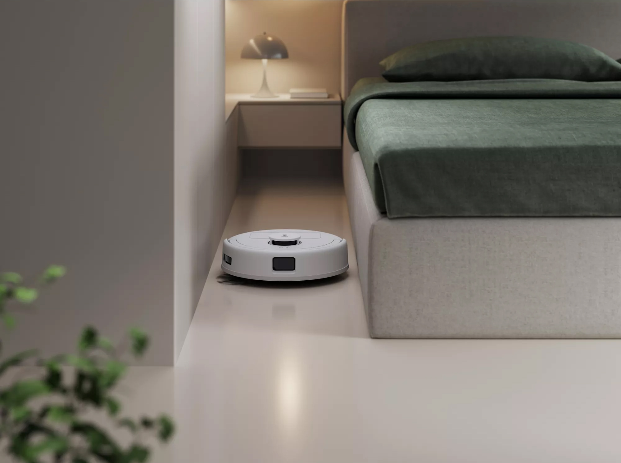 Robot Deebot Mini passant sous un meuble bas grâce à son format compact