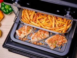 Aliments dorés et croustillants cuits dans le Moulinex Easy Fry 20L grâce à la technologie Extra Crisp