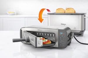 Grille-pain Ninja Foodi 3‑en‑1 montrant ses fonctions grille-pain, four et presse à panini.