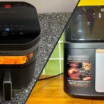 Photographie comparative montrant deux friteuses sans huile posées côte à côte sur un plan de travail de cuisine. À gauche, l'airfryer Moulinex Easy Fry Infrared de couleur noire. À droite, l'airfryer Essentiel B EAF4 Dual Heat, également noir. Les deux appareils sont de face, poignées vers l'avant.