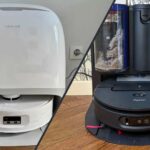 Photographie comparative montrant deux aspirateurs robots laveurs posés côte à côte sur un sol en parquet clair. À gauche, le Roborock Qrevo Curv 2 Flow, de couleur noire et légèrement plus haut, avec son télémètre laser visible sur le dessus. À droite, le Dyson Spot+Scrub Ai, également de couleur noire et grise avec des accents orange caractéristiques de la marque, affichant un design légèrement plus compact. Les deux robots sont orientés de face, permettant de visualiser leurs capteurs et leur caméra frontale.