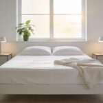 Lit Queen Size 160x200 cm dans une chambre moderne, illustrant un matelas pour couple