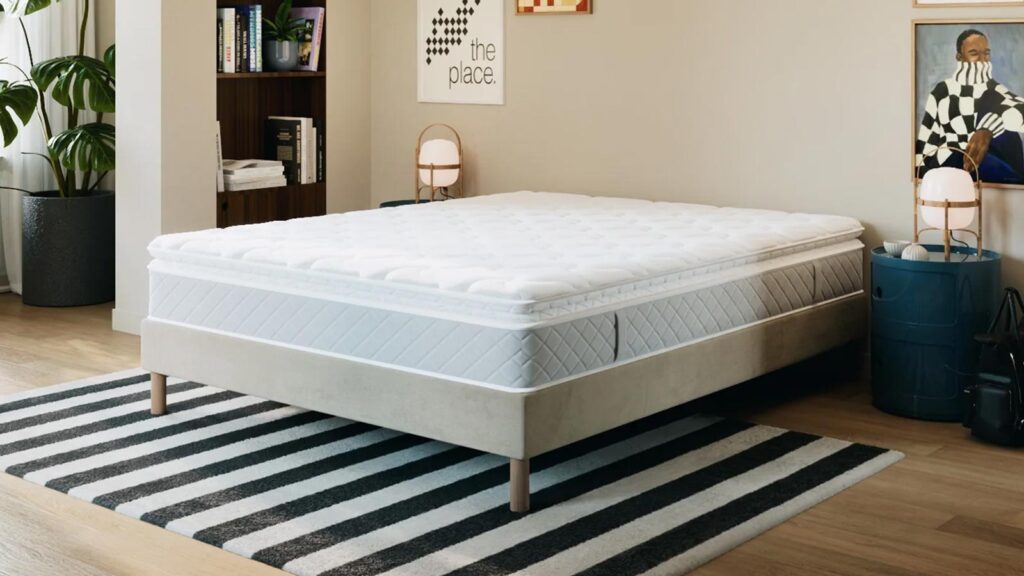 Matelas Hypnia Bien-être Suprême posé dans une chambre de couple, épaisseur 30 cm visible