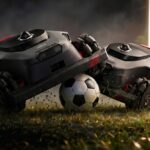 Le Robo Goal Challenge de Mova proposera aux visiteurs de former des équipes de deux et de prendre le contrôle d’un robot tondeuse sur un terrain spécialement conçu pour l’occasion. Photo générée par ChatGPT