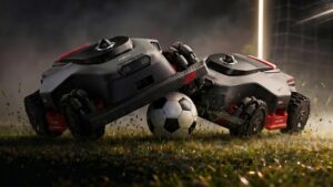 Le Robo Goal Challenge de Mova proposera aux visiteurs de former des équipes de deux et de prendre le contrôle d’un robot tondeuse sur un terrain spécialement conçu pour l’occasion. Photo générée par ChatGPT