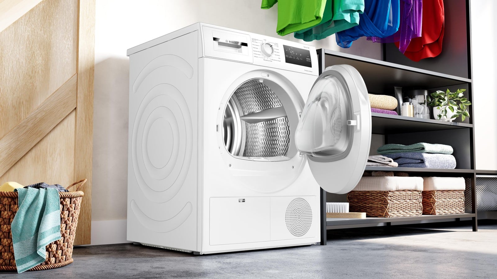 Sèche-linge Bosch WTH8300DFR hublot ouvert dans une buanderie
