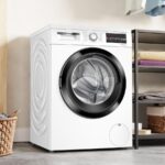 Lave-linge Bosch Série 6 WUU28T18FR installé dans une buanderie