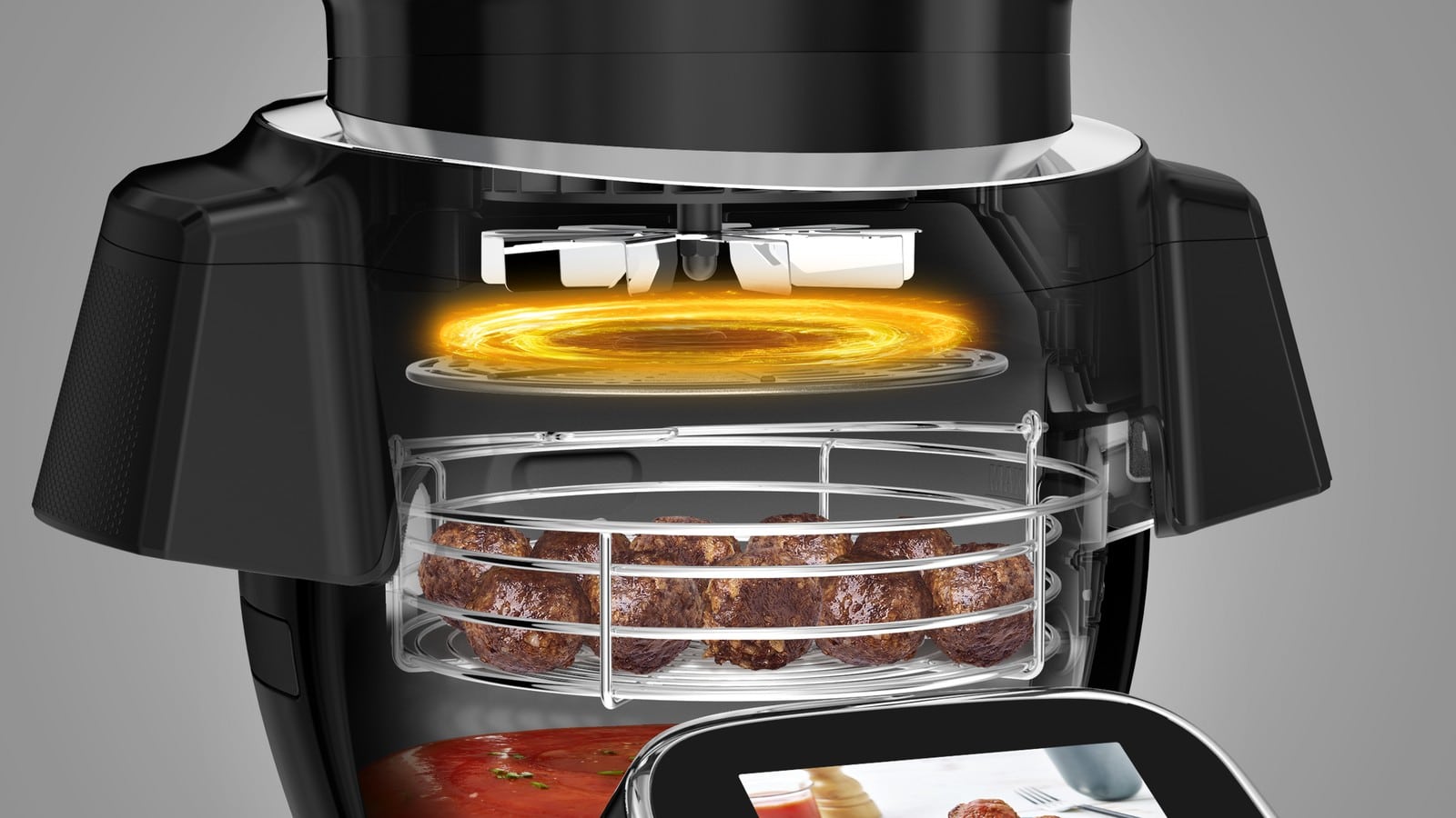 Vue en coupe du bol du Moulinex i-Companion Touch Pro avec le panier air fry garni de boulettes sous l’extension